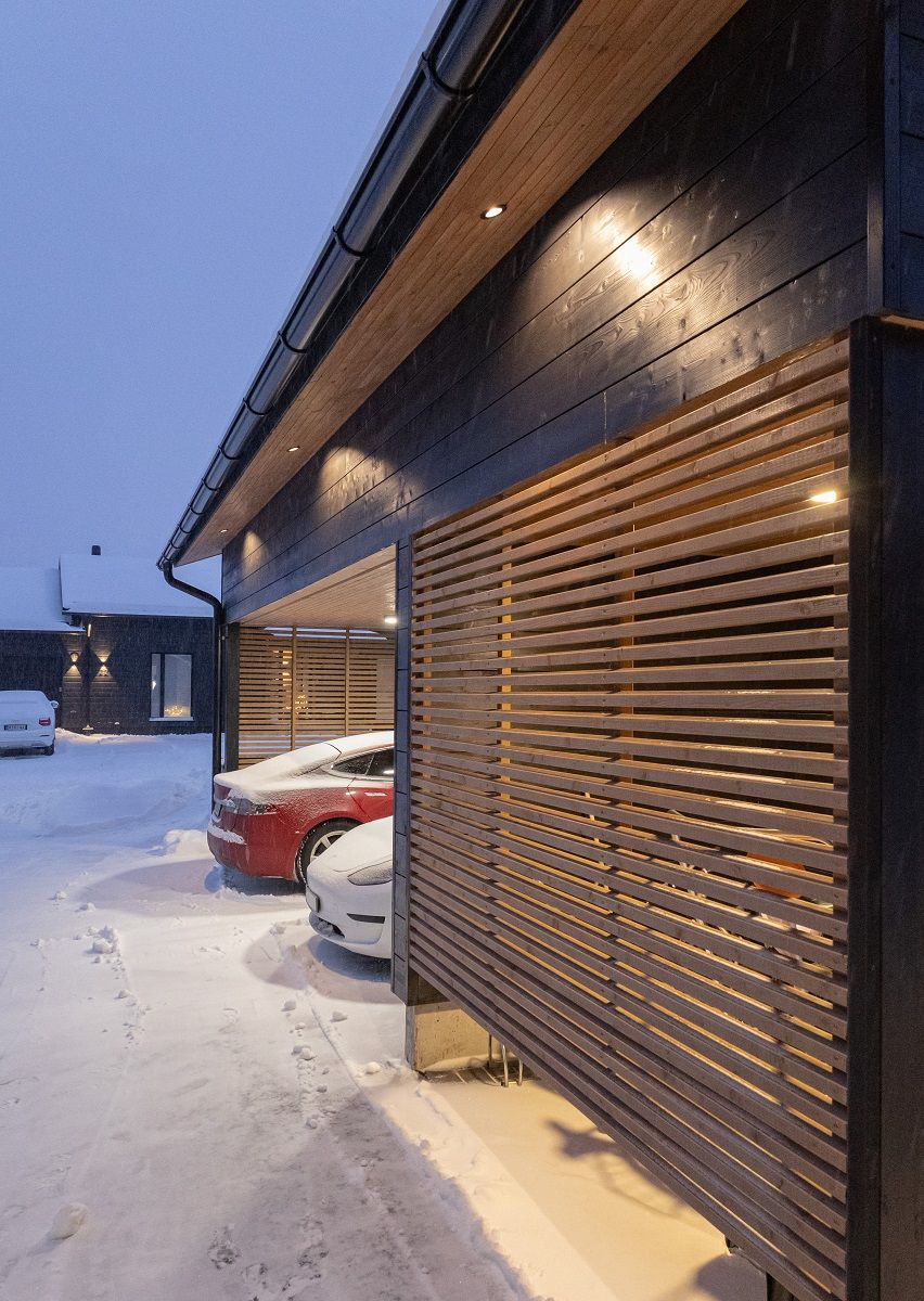 Flush mounted 9W spotlights illuminating downwards on the eaves of the carport outside